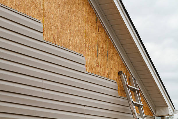 Professional Storm Damage Siding Repair technician working in Beallsville, MD